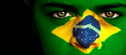 Woman with Brazilian flag painted on her face